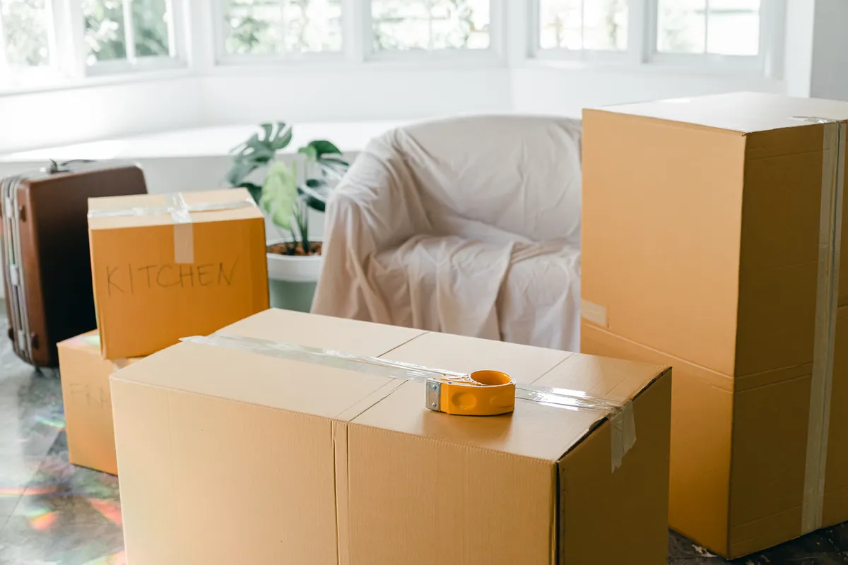 Packed moving boxes in a bright apartment